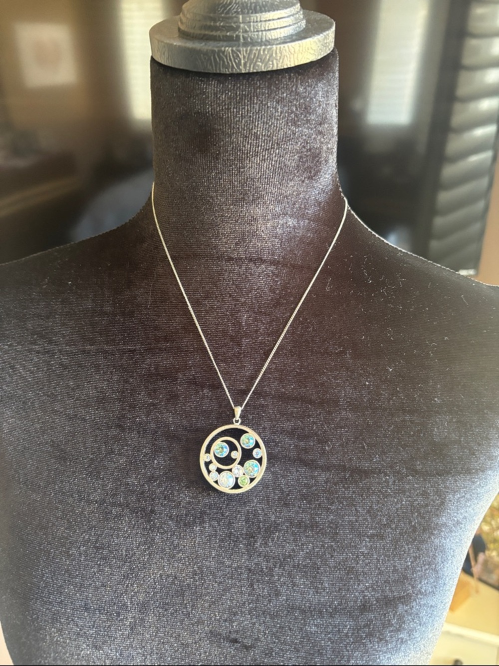Touchstone Crystal Silver-Tone Circular Pendant with Blue and Green Accents